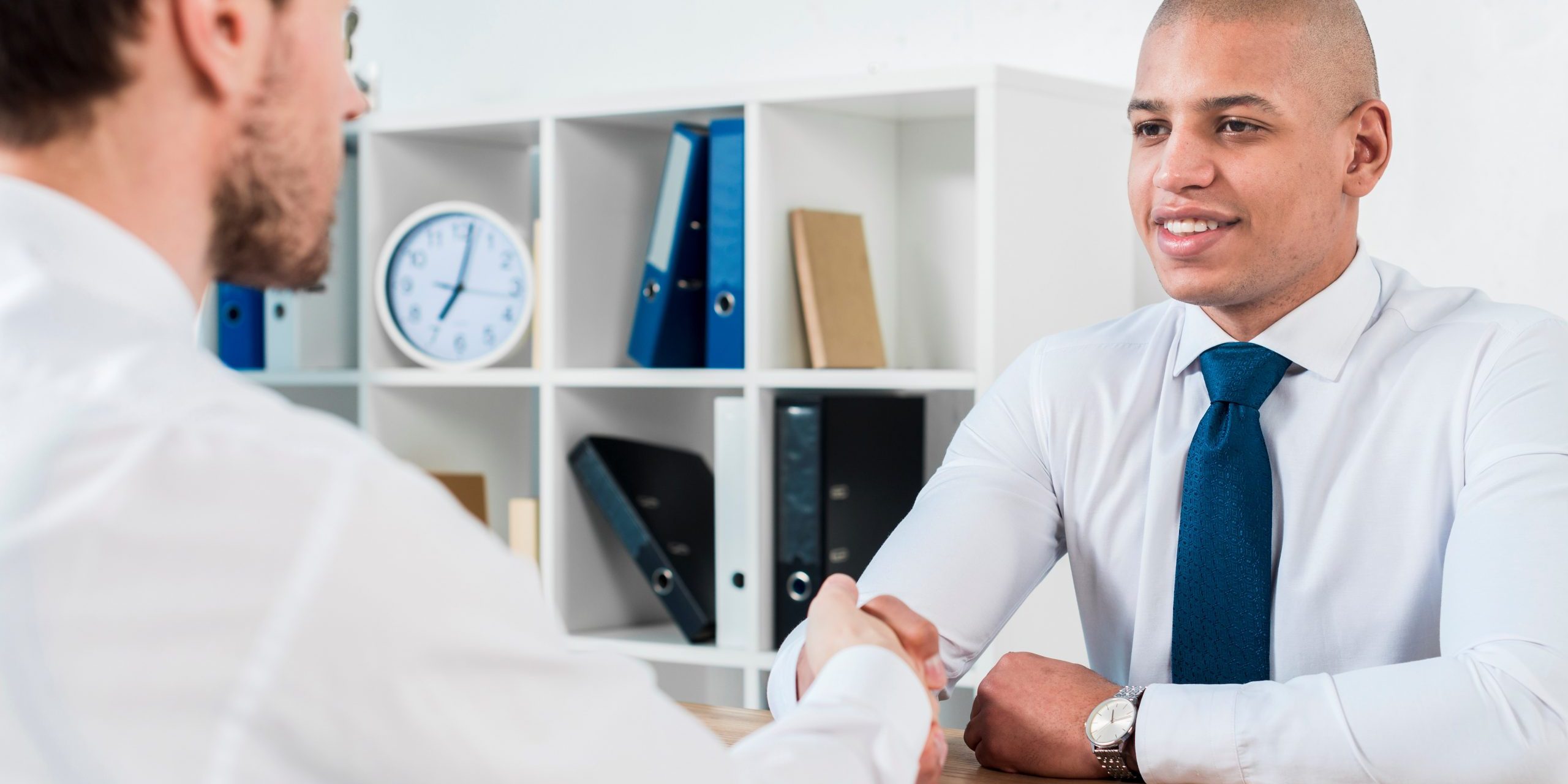 talent-pool-FP Men shaking hands in office illustrate blog "Exploring Alternative Talent Pools for Your Company"