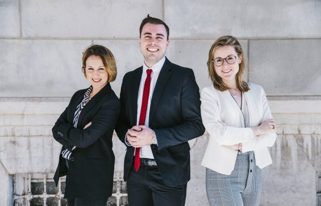 executives2-fp Three smiling office workers.