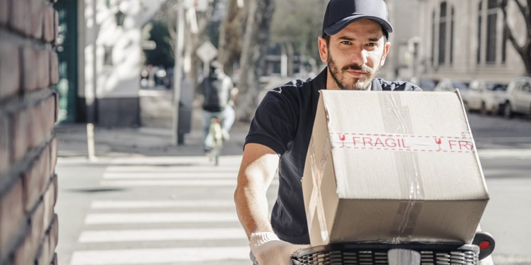 gig-freepik Man riding bicycle illustrates blog "The Gig Economy and Background Screening"